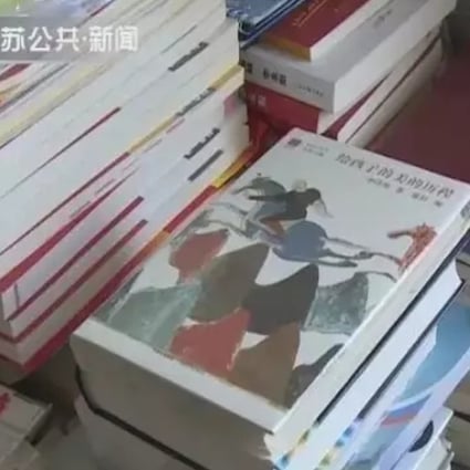 Some of the tens of thousands of books piled high in the couple’s home in Jiangsu province. Photo: Handout