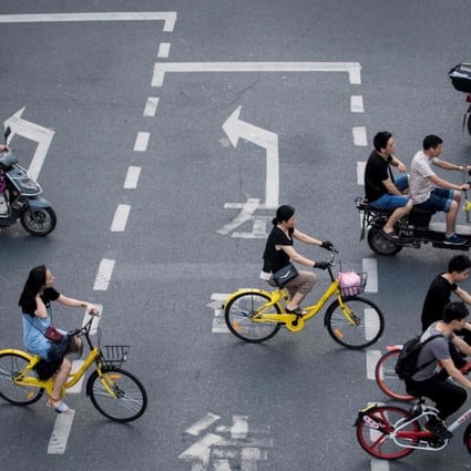 A group of bike sharers Shanghai. The authorities in Shanghai and Tianjin will impose regulations on the rapidly growing bike-sharing sector following mounting complaints over an accumulation of millions of the rentable two-wheelers on city streets. Photo: AFP