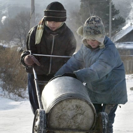 Children transport spring water to their village outside Khabarovsk, Russia. A 100 billion yuan investment fund is the latest in a string of efforts to strengthen ties along the border of China and Russia. Photo: AFP