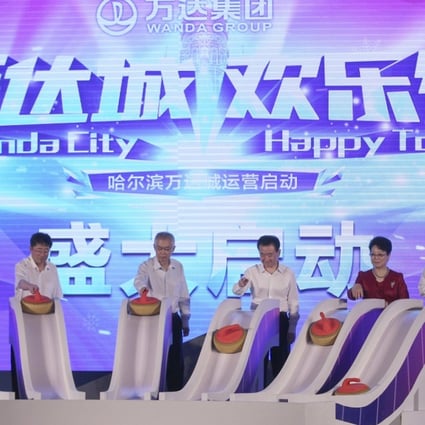 The official opening of Wanda City in Harbin on June 30, attended by Wang Jianlin (centre, right). Just over a week later Wang announced the sale of the assets to Sunac. Photo: Simon Song