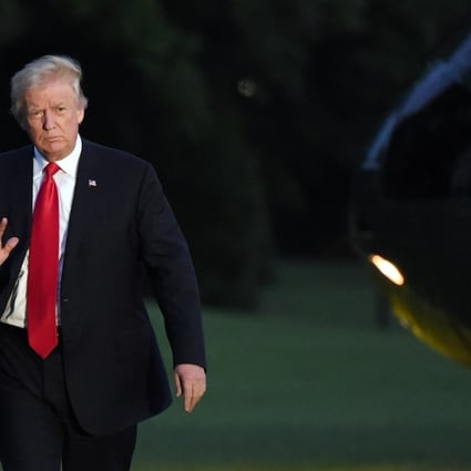 US President Donald Trump waves as he returns to the White House after the G20 summit meeting in Germany. Photo: Bloomberg