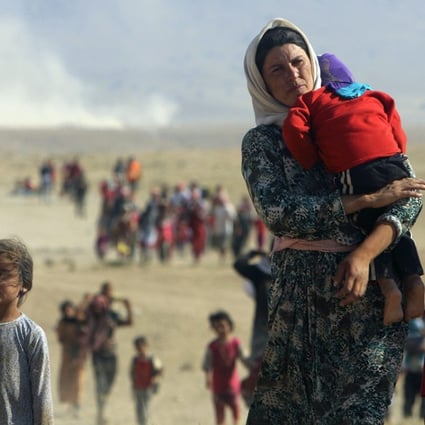 Yazidi refugees flee Islamic State forces in northern Iraq in August 2014. Photo: Reuters