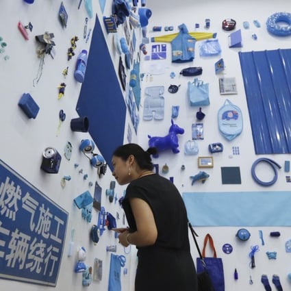 Our Red Pocket for Your Favourite Blue exhibition at OCT Art & Design Gallery in Shenzhen by Polit-Sheer-Form Office encourages visitors to swap so-called lucky money for a donated blue item. Photo: sNora Tam