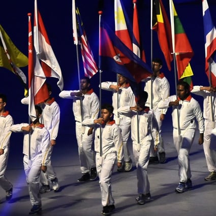 Flag-bearers from the participating countries march in the opening ceremony of the 2015 Southeast Asian Games, in Singapore on June 5 that year. The biennial event will be hosted by Malaysia in August this year. Photo: AFP