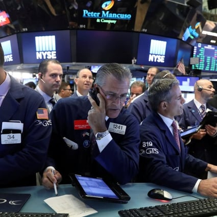 Traders in the New York Stock Exchange on July 19. Correlated world markets means there may be no place to hide. Photo: Reuters