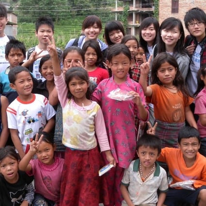 Teenage volunteer teachers from Hong Kong with children they taught in Nepal. Photo: Mabel Sieh