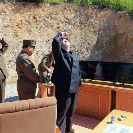 North Korean leader Kim Jong-un inspects the successful test-firing of the intercontinental ballistic missile Hwasong-14, at an undisclosed location on July 4. Photo: AFP/KCNA via KNS