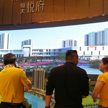 Propsective buyers checking out a scale model of the Evergrande Mansion development at the Nanhai Gaoxin district in Foshan city in Guangdong province. Photo: SCMP/Xiaomei Chen