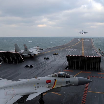 Chinese J-15 fighter jets are launched from the deck of the Liaoning aircraft carrier during earlier military drills in the Yellow Sea on December 23. Photo: AFP