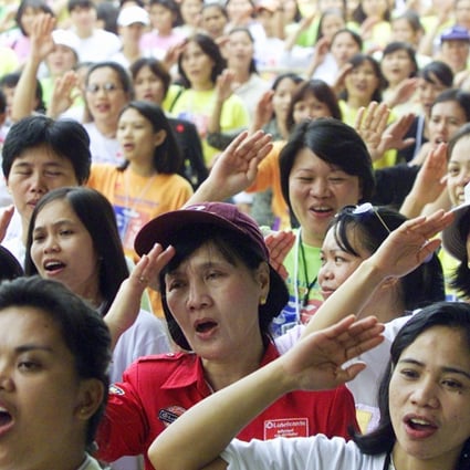Hundreds of Filipino domestic workers pictured in Hong Kong. They are also widely employed in Singapore and Canada. Photo: Reuters