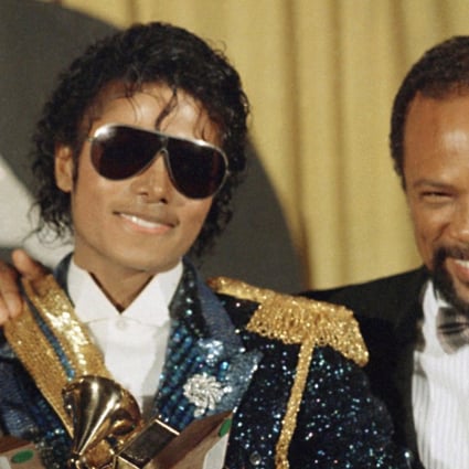 In this 1984 file photo, Michael Jackson, left, holds eight awards as he poses with Quincy Jones at the Grammy Awards in Los Angeles. Jackson's estate announced on August 7, 2017, that a 3D version of his iconic "Thriller" video will debut at the Venice Film Festival, which begins on August 30. Photo: AP