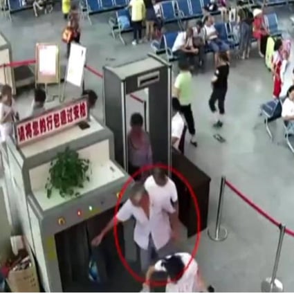 The man pictured going through the security scanner in Guizhou province. Photo: Handout