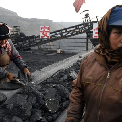 A file picture of workers sorting coal at a mine in Datong in Shanxi province. Photo: AFP