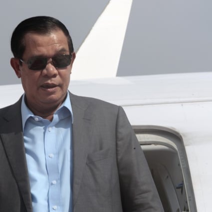 Cambodian Prime Minister Hun Sen exits the plane as his arrives from Laos in Phnom Penh, Cambodia. Photo: AP