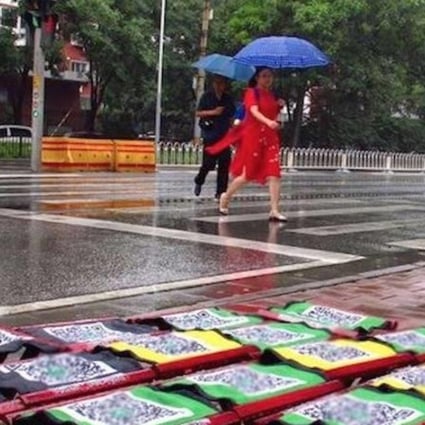 The folding stools for rent in rainy Beijing. Photo: Handout