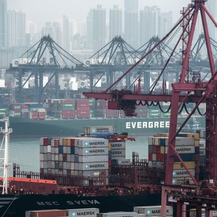 Container ships sit moored next to shipping containers and gantry cranes at the Kwai Tsing Container Terminals. Photo: Bloomberg