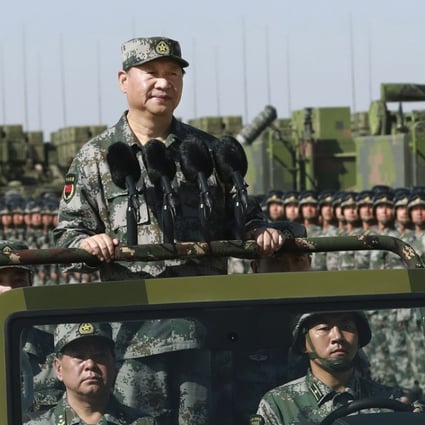 President Xi Jinping inspects troops during a military parade to commemorate the 90th anniversary of the founding of the PLA, at a training base in Inner Mongolia on July 30. Photo: Xinhua