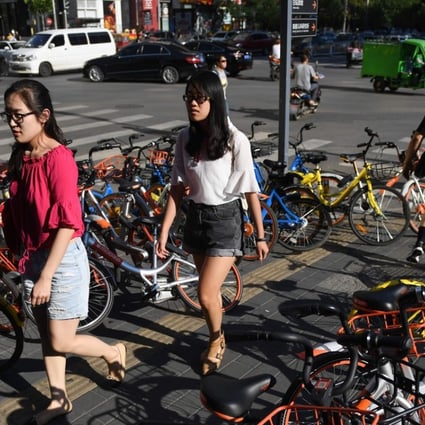 Youon, which debuted on the Shanghai bourse, has warned of risk from competition from bike-sharing apps, Ofo and Mobike that have strong funding support. Photo: AFP