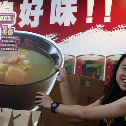An exhibitor gets ready for the opening of the Hong Kong Food Expo on Thursday. Photo: Nora Tam