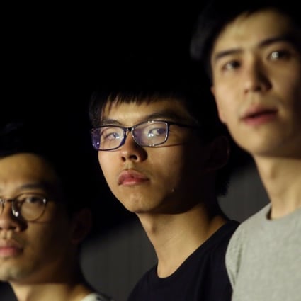 (From left) Nathan Law Kwun-chung, Joshua Wong Chi-fung and Lester Shum attend a protest in support of 13 protesters who were jailed on Tuesday. Photo: Sam Tsang