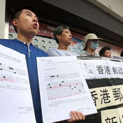 Hongkong Post employees hold a protest outside the General Post Office in Central. Photo: Edward Wong