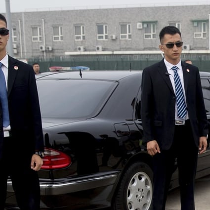 A company from Qingdao is planning to launch an app that will allow people to rent bodyguards by the hour. Photo: AP