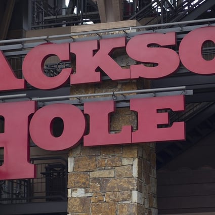 Employees put the finishing touches on exterior signage at the Jackson Hole Mountain Resort in Jackson, Wyoming, ahead of the central bankers’ meeting which gets underway Thursday. Photo: EPA