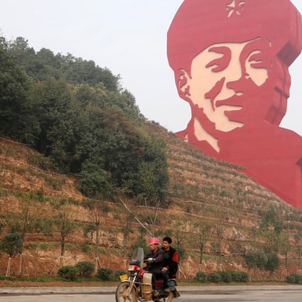 A 30-metre statue of Lei Feng dominates the horizon in Changsha, the hometown in Hunan province of the Cultural Revolution hero whose story has been used to instil the love of country in generations of Chinese students. Photo: Xinhua