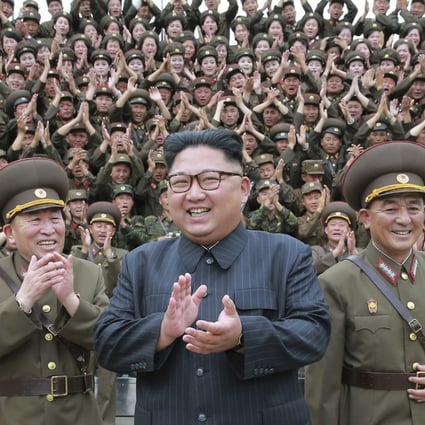 North Korean leader Kim Jong-un flanked by military officers. Photo: AP
