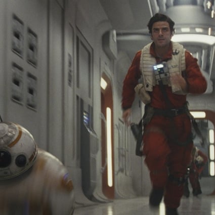 BB-8 (left) and Poe Dameron (Oscar Isaac) in a still from Star Wars: The Last Jedi. Photo: courtesy of Lucasfilm.