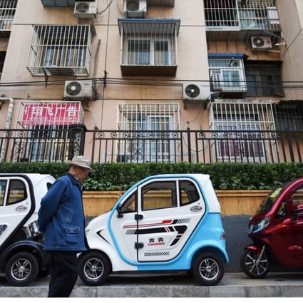 Electric vehicles on a sidewalk in Beijing. Photo: AFP
