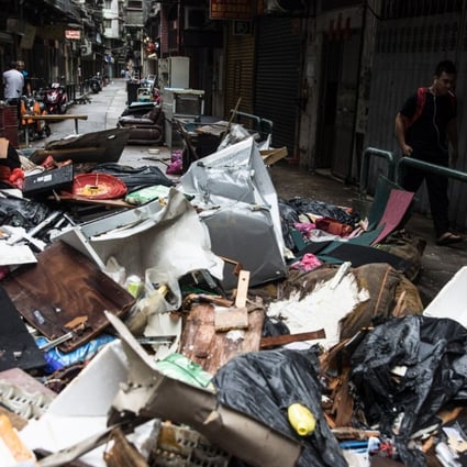 Debris and rubbish piled up on a Macau street in the aftermath of Typhoon Hato. Photo: AFP