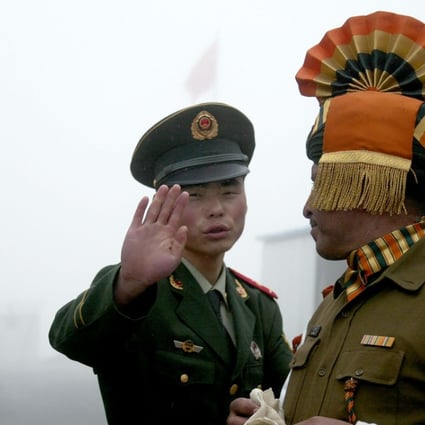 A file picture of Chinese and Indian soldiers at a border crossing in Sikkim state. A standoff between the two nations’ militaries on another stretch of the border ended this week. Photo: AFP