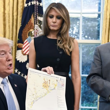 US President Donald Trump holds a map of the Texas Gulf coast. Photo: Bloomberg