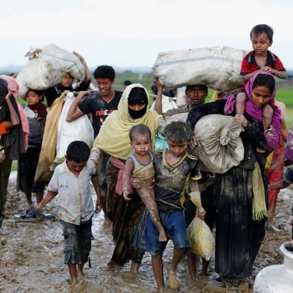 A group of Rohingya refugees travelling over the Bangladesh-Myanmar border. Photo: Reuters