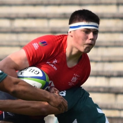 Hong Kong's Jake Barlow is stopped in his tracks against Portugal. Photos: HKRU