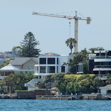 Growth in Australia’s home prices slowed in August, dampened by the flat and slight growths in Sydney and Melbourne. Prices for Sydney properties such as these over waterfront were flat, compared with 1.4 per cent rise in July. Photo: Reuters