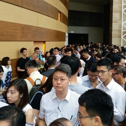 Long odds: More than 1,000 home seekers queued for the chance to get their hands on just four flats in Parc City, Tsuen Wan. Photo: Peggy Sito