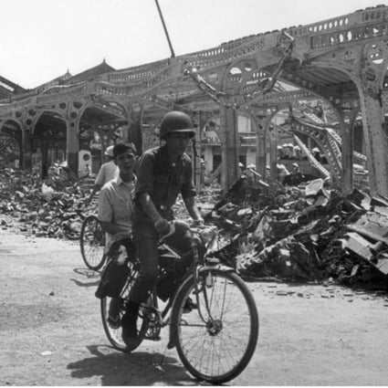 A South Vietnamese soldier rides his bike near the destroyed market of Kien Hoa, in February 1968, after a North Vietnamese attack as part of the Vietcong Tet offensive during the Vietnam war. Photo: AFP