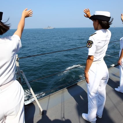 Chinese officers wave goodbye to the Russian fleet at the end of a joint naval drill off Guangdong in September last year. Photo: Xinhua