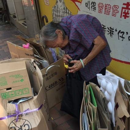 An 89-year-old woman collects used cardboard in Causeway Bay. Photo: Denise Tsang