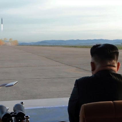 An undated photo released on 16 September 2017 by the North Korean Central News Agency (KCNA), the state news agency of North Korea, is described as showing the country's leader Kim Jong Un (R), supreme commander of the Korean People's Army, guiding a launching of the medium-to-long range strategic ballistic rocket Hwasong-12 at an unspecified location (issued 16 September 2017). EPA-EFE/KCNA