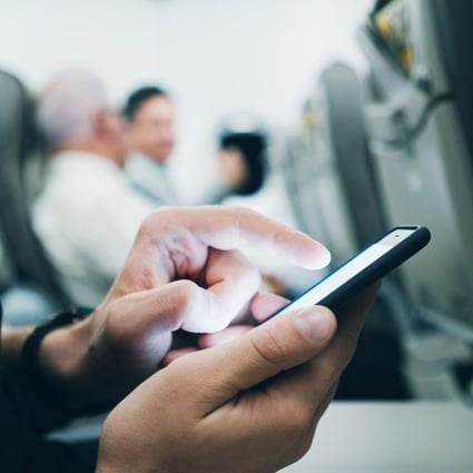 Currently Chinese air passengers are not allowed to use their devices during a flight. Photo: Shutterstock