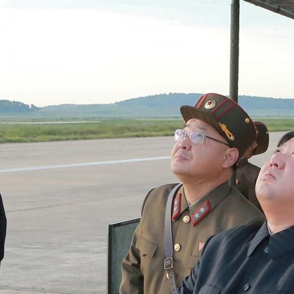 North Korean leader Kim Jong-un (right) pictured watching the launch of a Hwasong-12 missile in a photograph released by North Korean state media earlier this month. Photo: Reuters