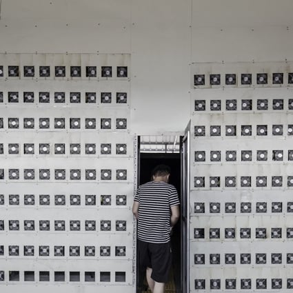 Technicians exit a cooling chamber near a wall of bitcoin mining machines at a mining facility operated by Bitmain Technologies in Inner Mongolia, China. Photo: Bloomberg