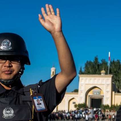 Police on patrol near a mosque in Kashgar in China’s restive Xinjiang province. The nation’s security chief hopes the use of technology will help predict where terror attacks may take place. Photo: AFP