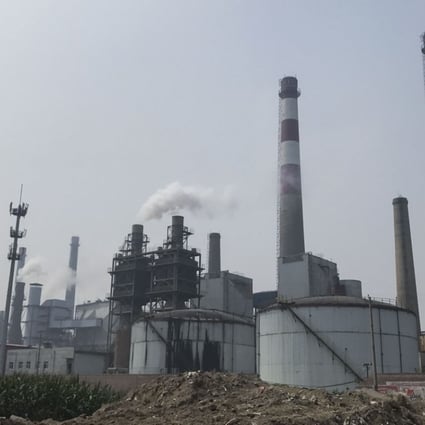 Chimneys at a glass factory in Shahe, Hebei, emit plumes of sour-smelling steam on September 12. Photo: Viola Zhou