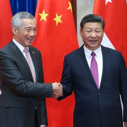 Singapore’s Prime Minister Lee Hsien Loong (left) shakes hands with China's President Xi Jinping before their meeting at the Great Hall of the People in Beijing on Wednesday. Photo: AFP