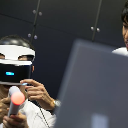 A visitor to the Tokyo Game Show experiences a PlayStation VR game. Photo: EPA-EFE