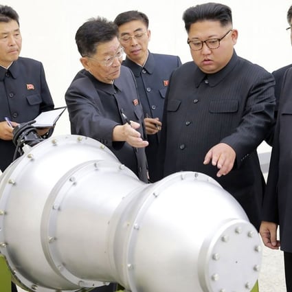 North Korean leader Kim Jong-un inspects what is said to be a miniaturised hydrogen bomb. Photo: AFP